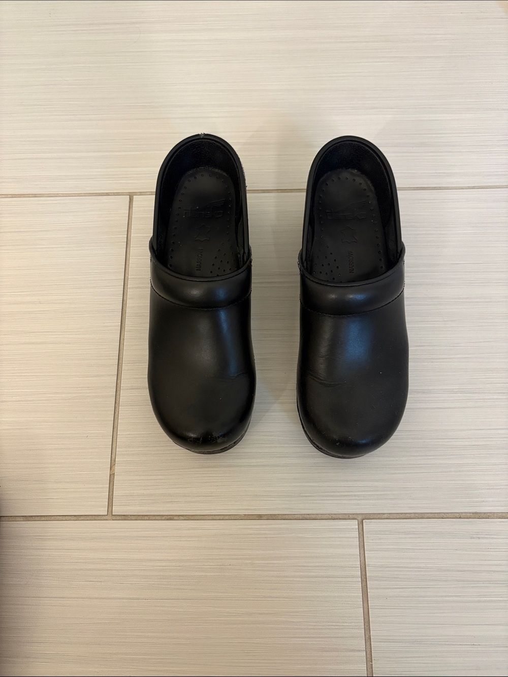 Dansko Women's Black Slip-On Leather Clogs